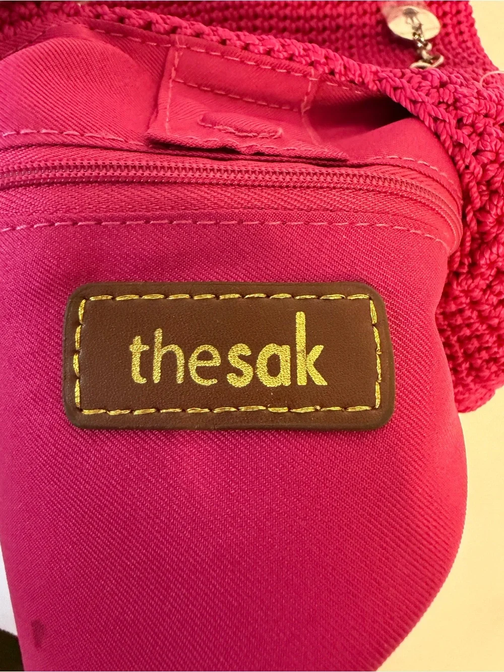 The Sak raspberry, pink handcrafted crochet hobo shoulder bag